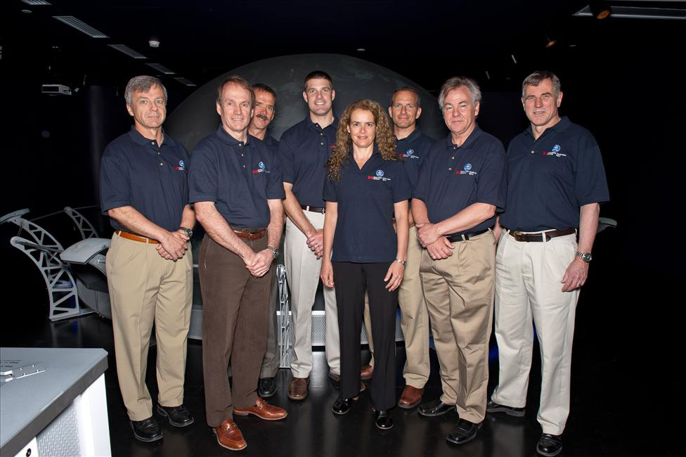 Canadian astronauts pose inside the Living in Space Exhibition