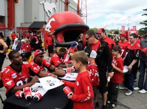 Calgary Stampeders players Jabari Arthur, Quincy Butler and Marvin White meet fans and sign autographs