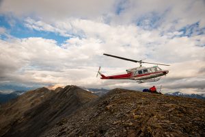 Alpine heli approaches Powder Pig Ridge for an evening shoot
