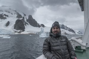 Javier Frutos wears Columbia jacket on ship