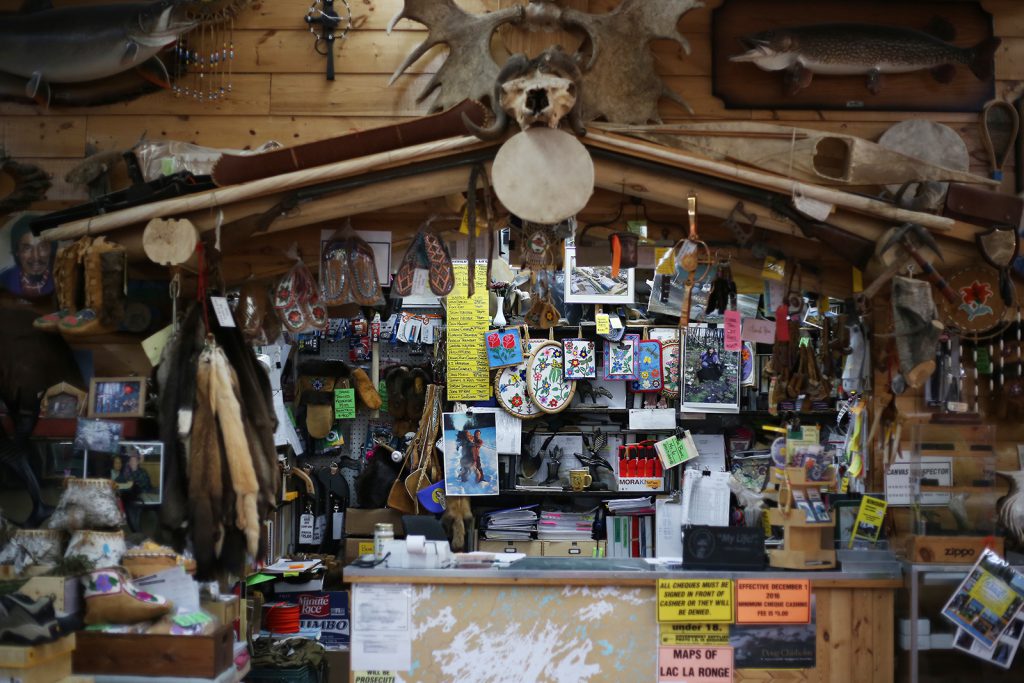 Interior view of Robertson Trading Co. in La Ronge, Saskatchewan showing a variety of items for sale, including raw furs