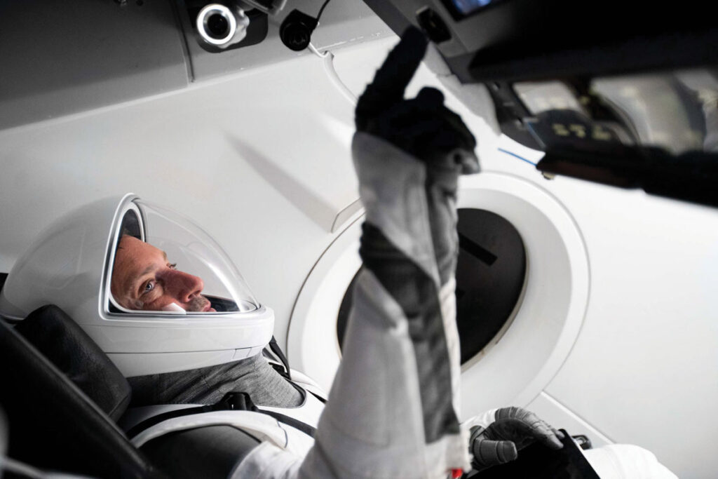 Astronaut inputs information into onboard computer
